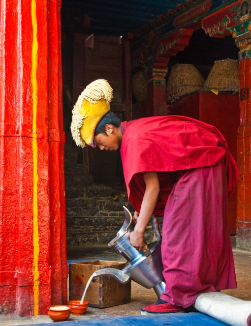 Monk in Tashilhunpo pouring Po Cha